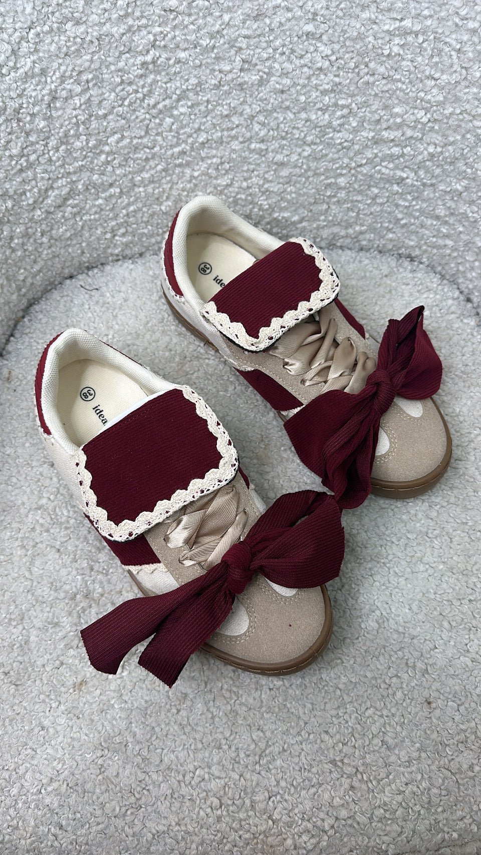 PHOENIX burgundy and cream bow detail trainers