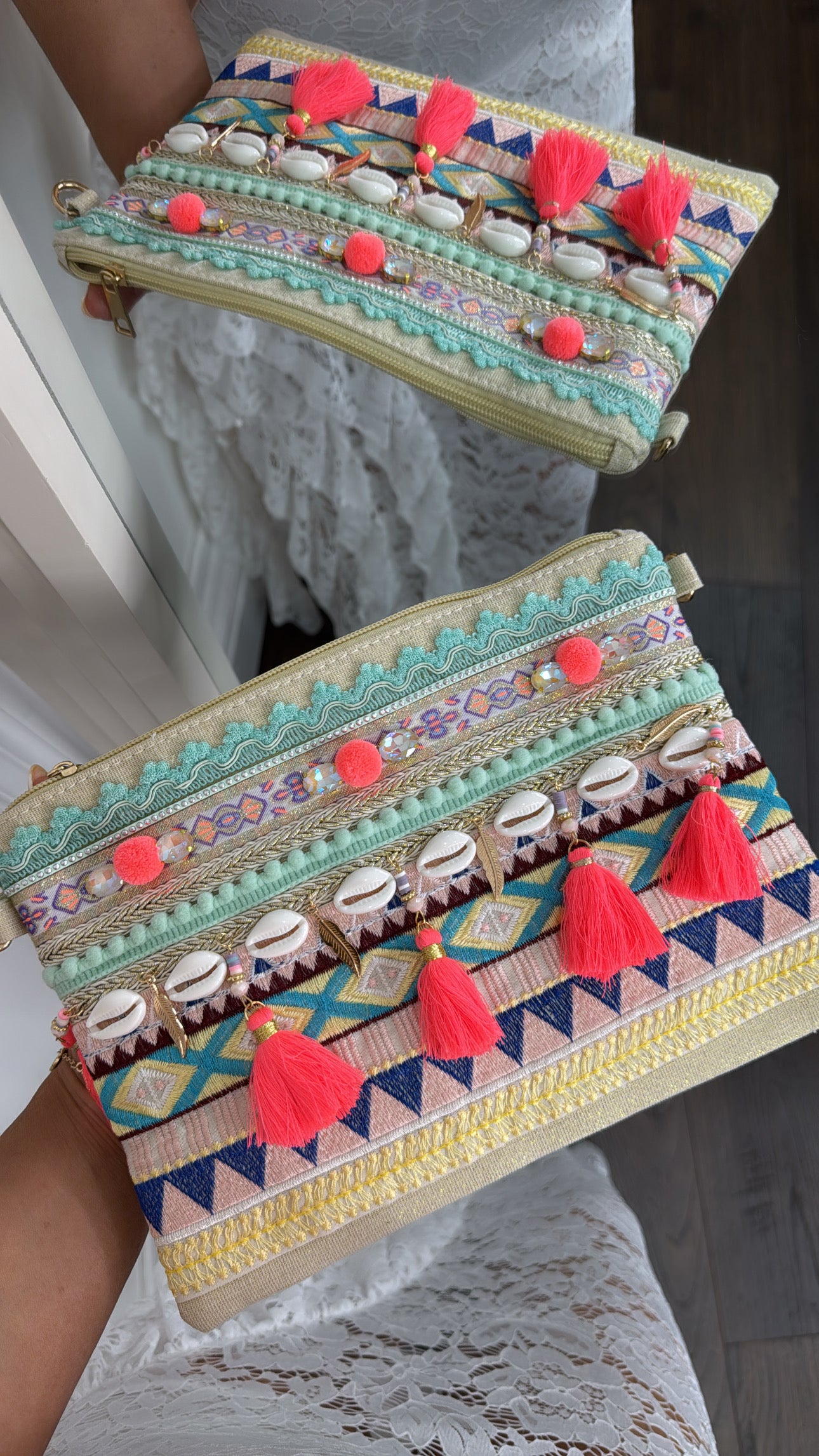 SHELBY neon pink pom pom and shell clutch bag
