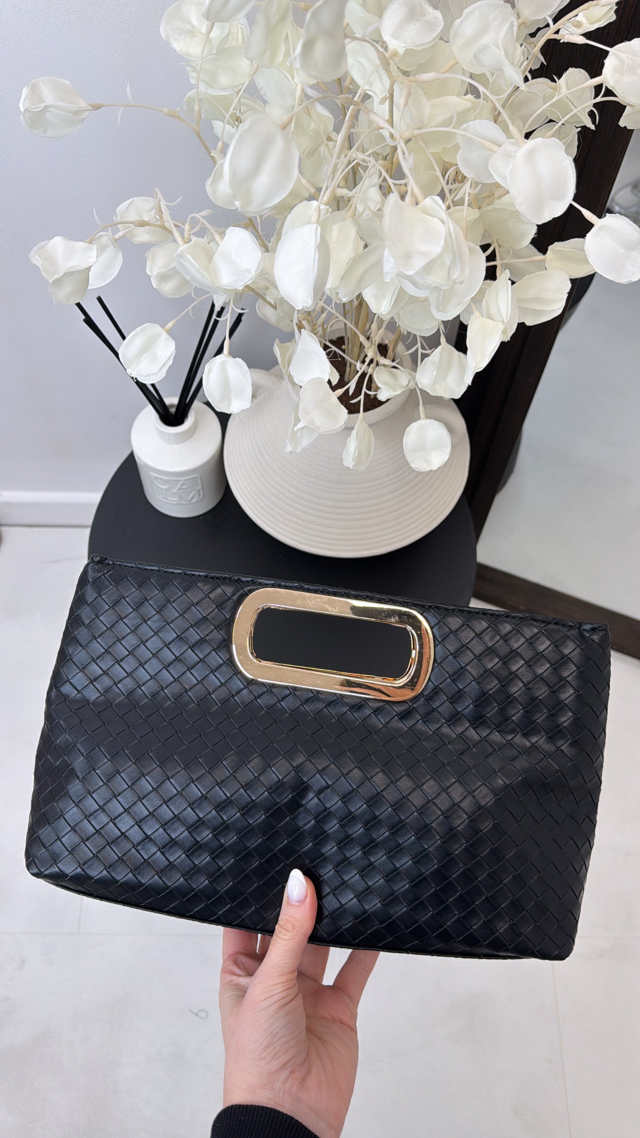 ANI black woven clutch bag with gold detail