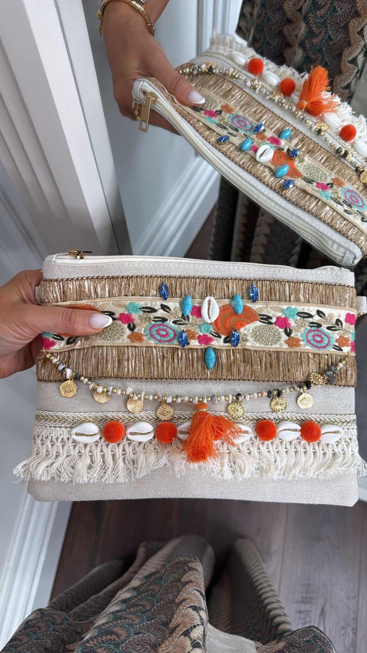 SHELBY orange shell and pom pom clutch bag