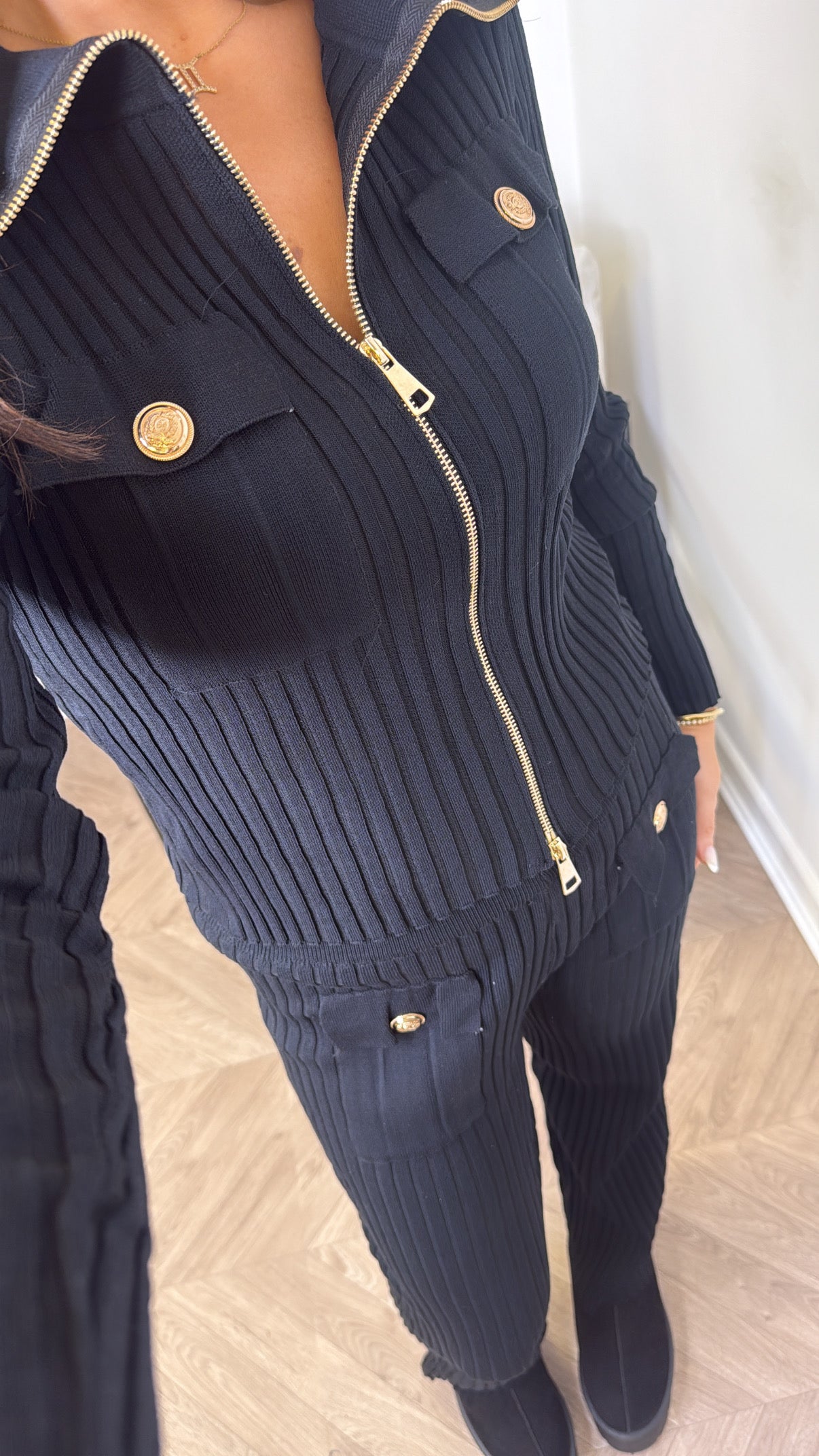 EVA black ribbed knitted zip top with gold button detail and wide leg trousers co-ord