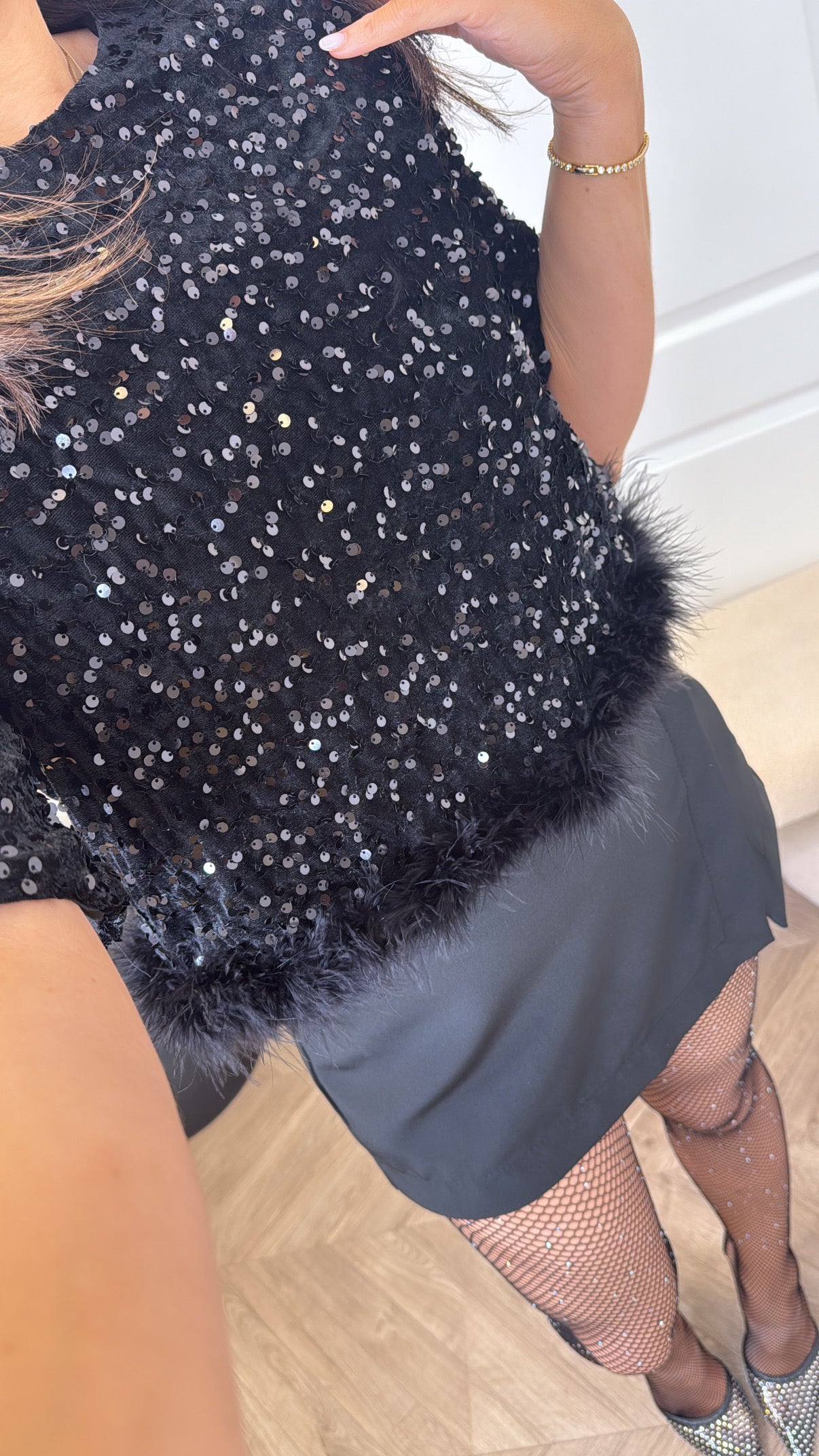 CHRISSY black sequin top with fluffy hem