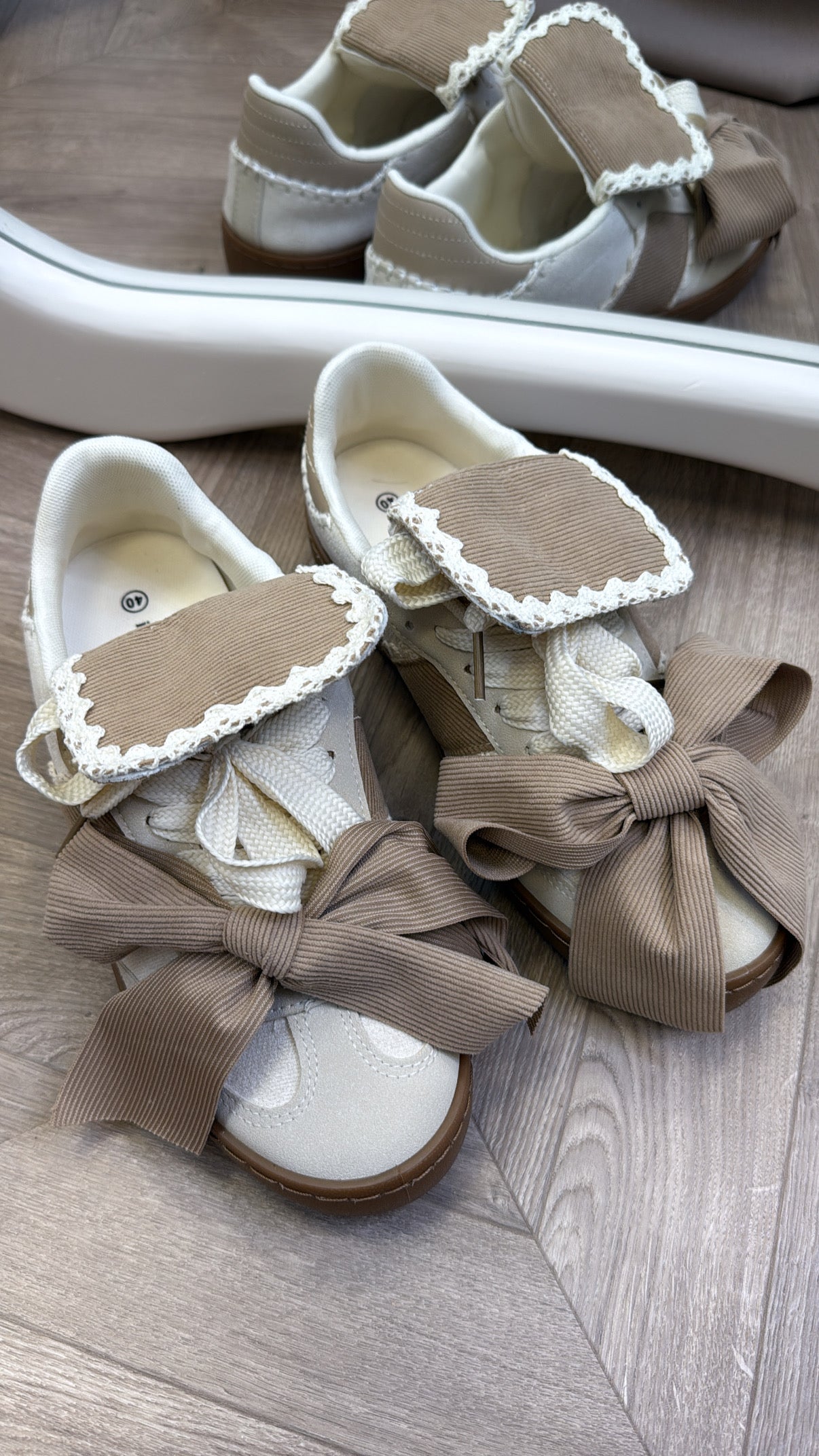 PHOENIX beige and cream bow detail trainers