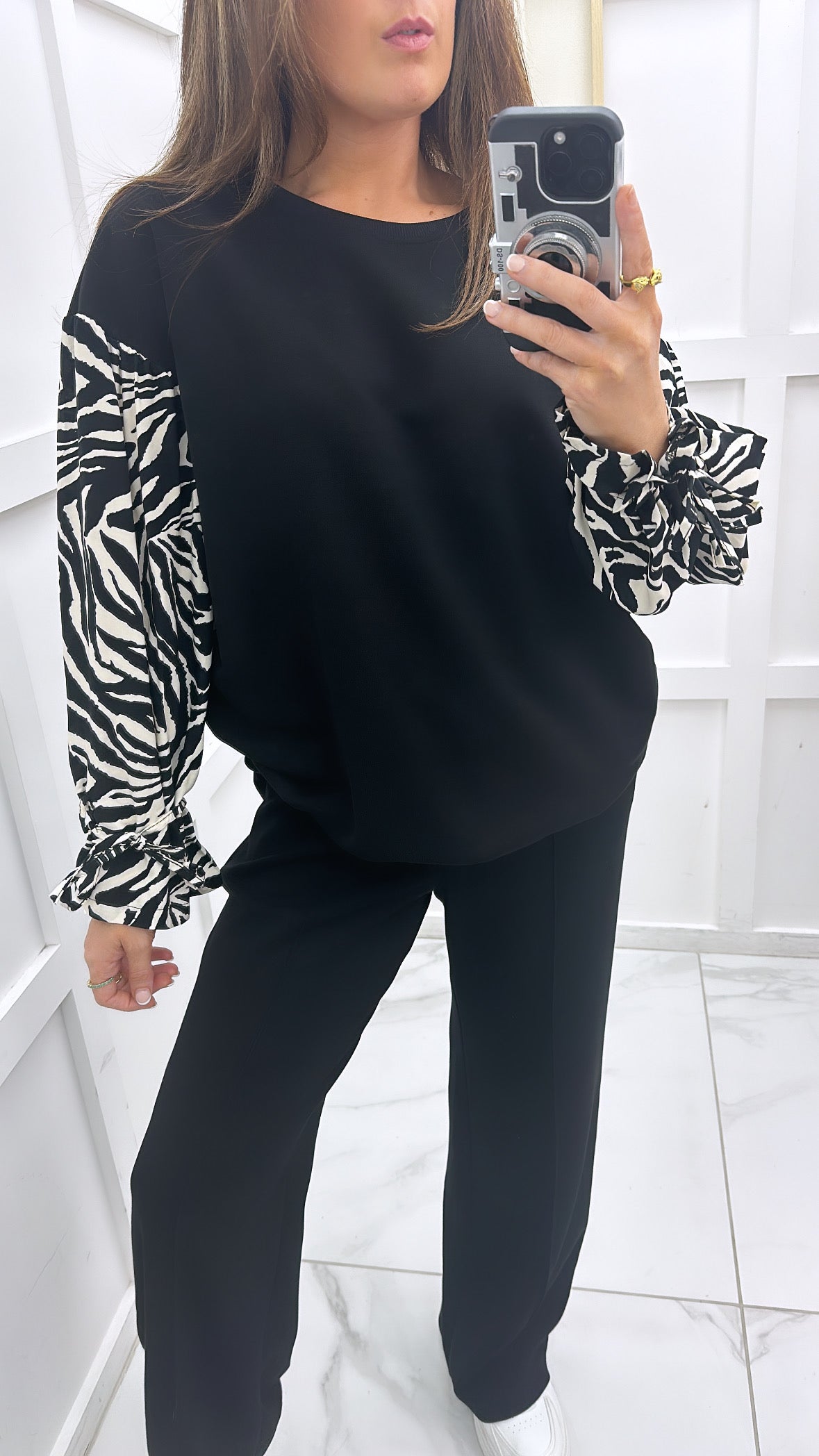 ESME black sweatshirt with zebra print sleeves