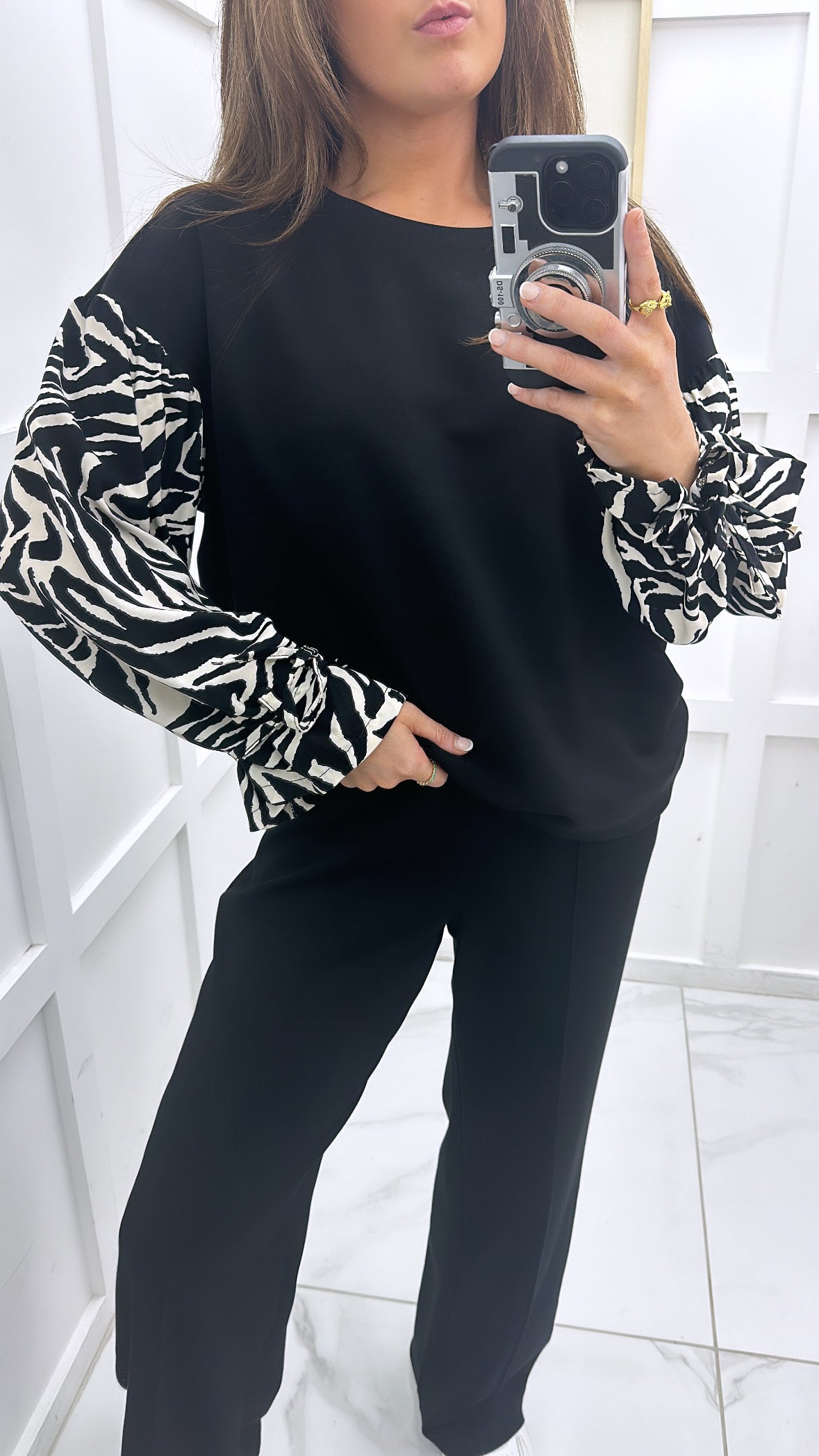 ESME black sweatshirt with zebra print sleeves