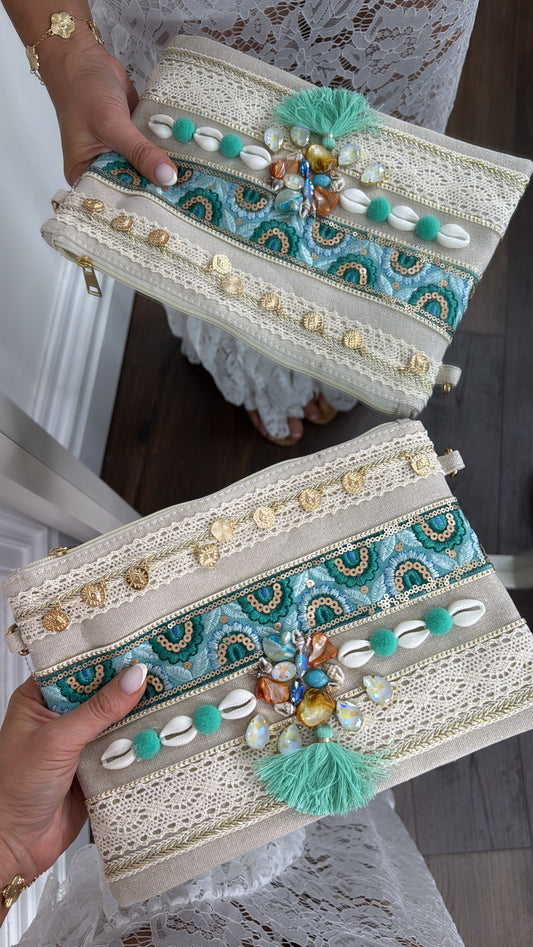 SHELBY green shell and pom pom clutch bag