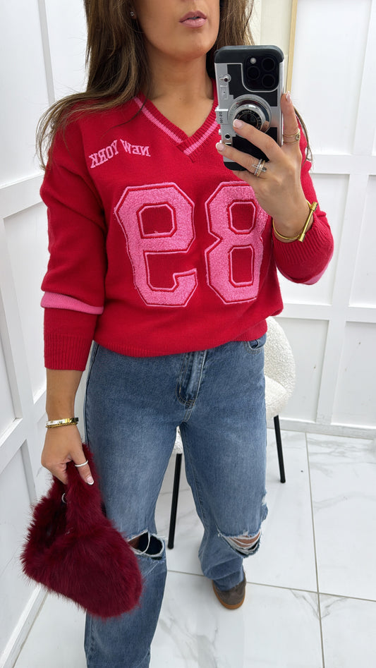 89 NEW YORK red jumper with teddy detail