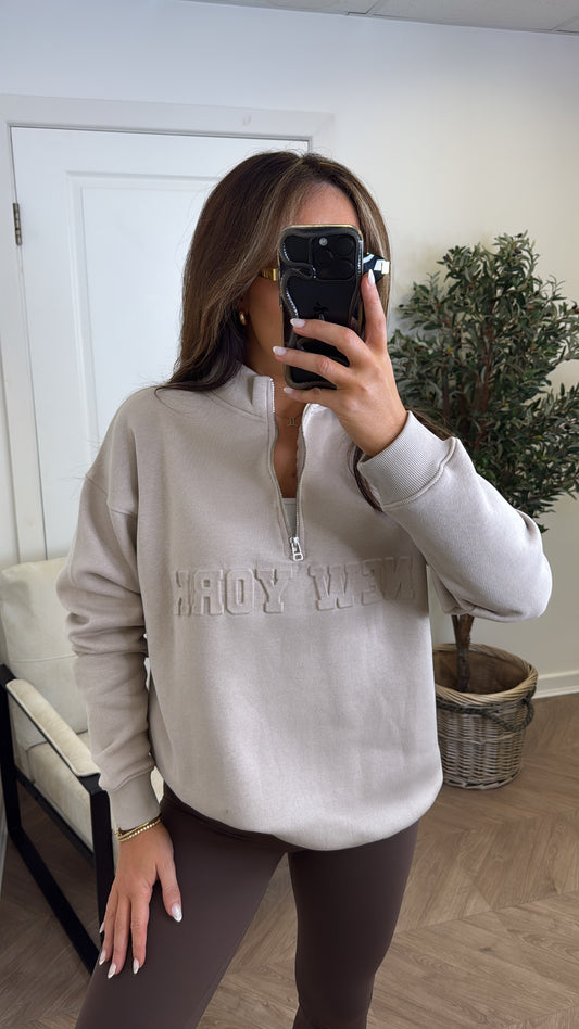 NEW YORK beige embossed logo half zip oversized sweatshirt