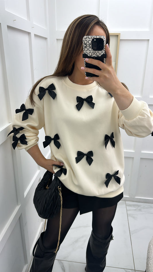 BELLA cream jumper with black ribbon bows