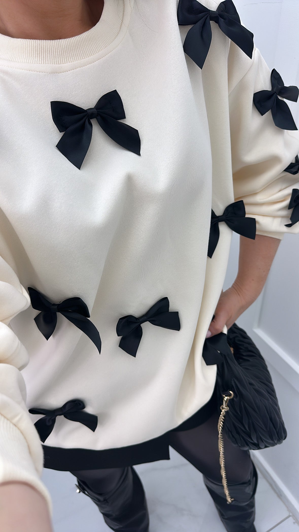 BELLA cream jumper with black ribbon bows