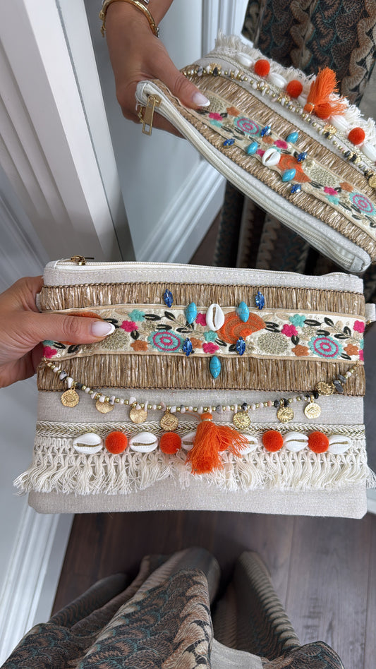 SHELBY orange shell and pom pom clutch bag